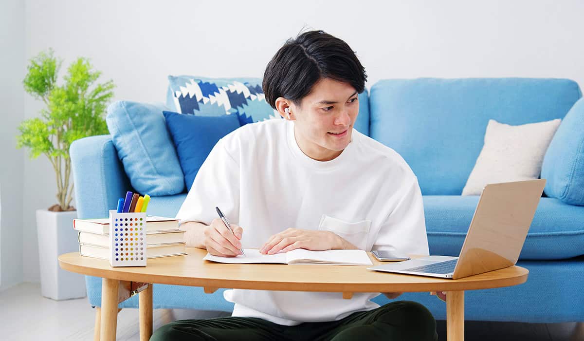 An image of someone studying with a laptop