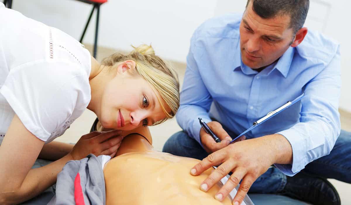 Image of someone being assessed performing Checking airways